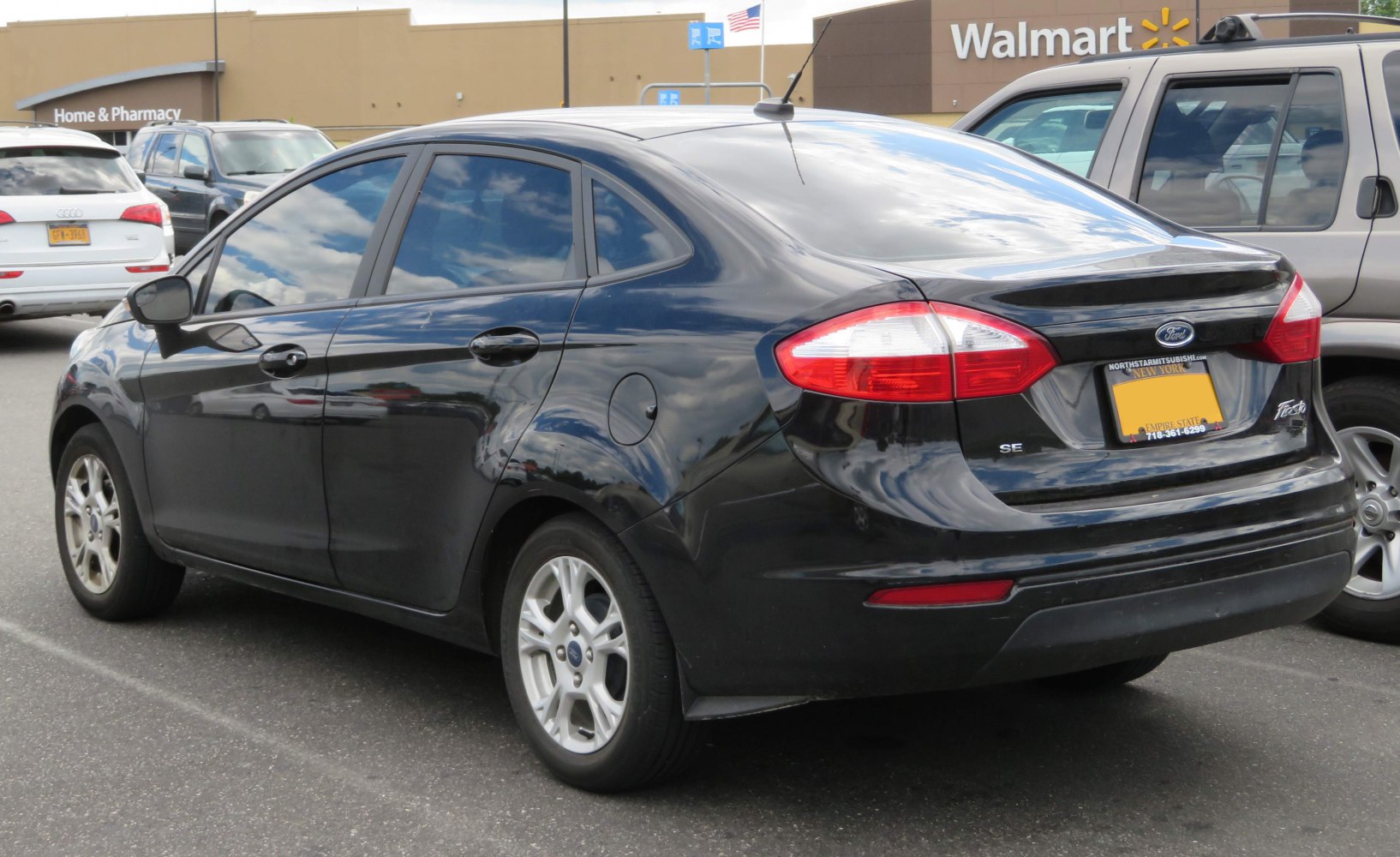 Rear view with prominent taillights and alloy wheels
