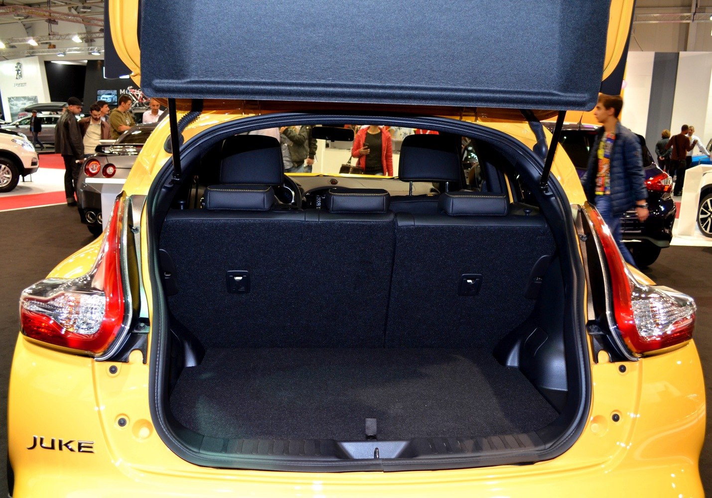 Open trunk space and rear seats view of a compact hatchback