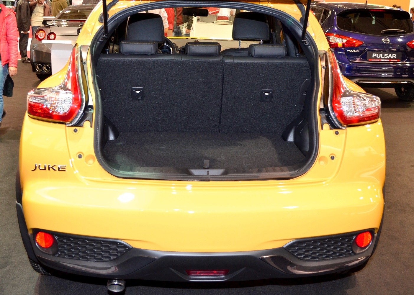 Open trunk view with rear seats and cargo space in compact SUV