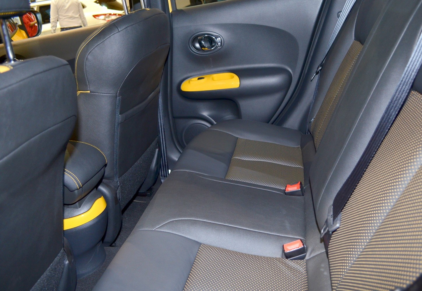 Rear seat interior with leather upholstery and yellow accents