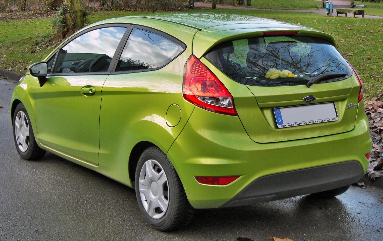 Rear side of 3-door hatchback with compact streamlined design and distinctive taillight