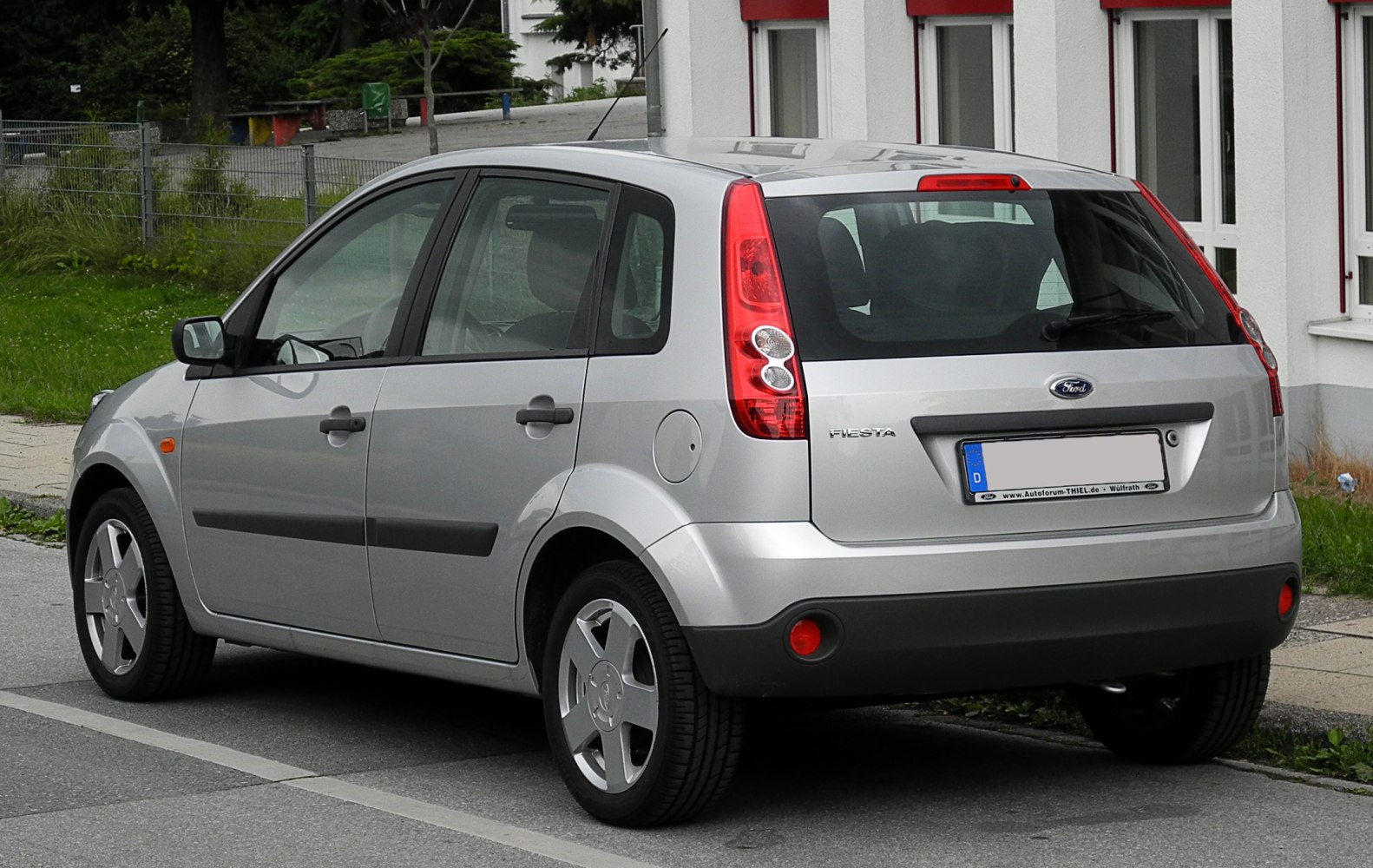 Compact 5-door hatchback with vertical rear lights and silver paint