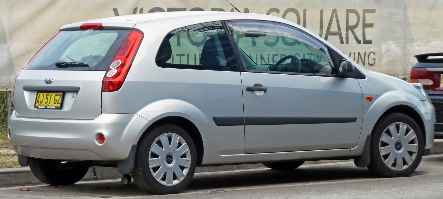 Side and rear view of a 3-door hatchback with facelift design