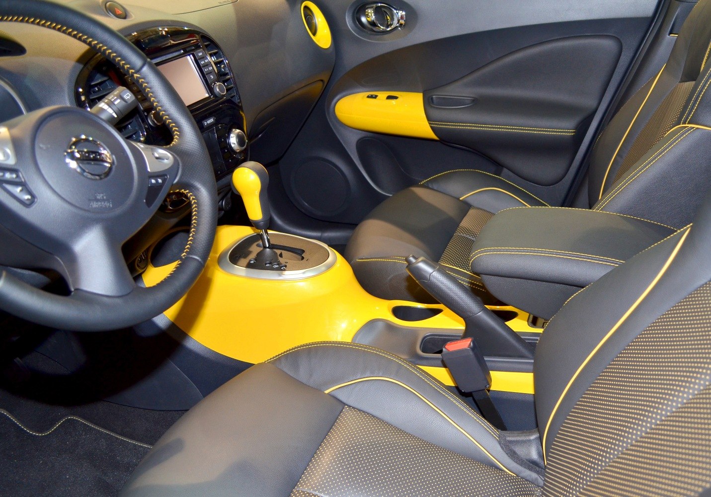 Yellow-accented gear lever and door panel with black leather seats