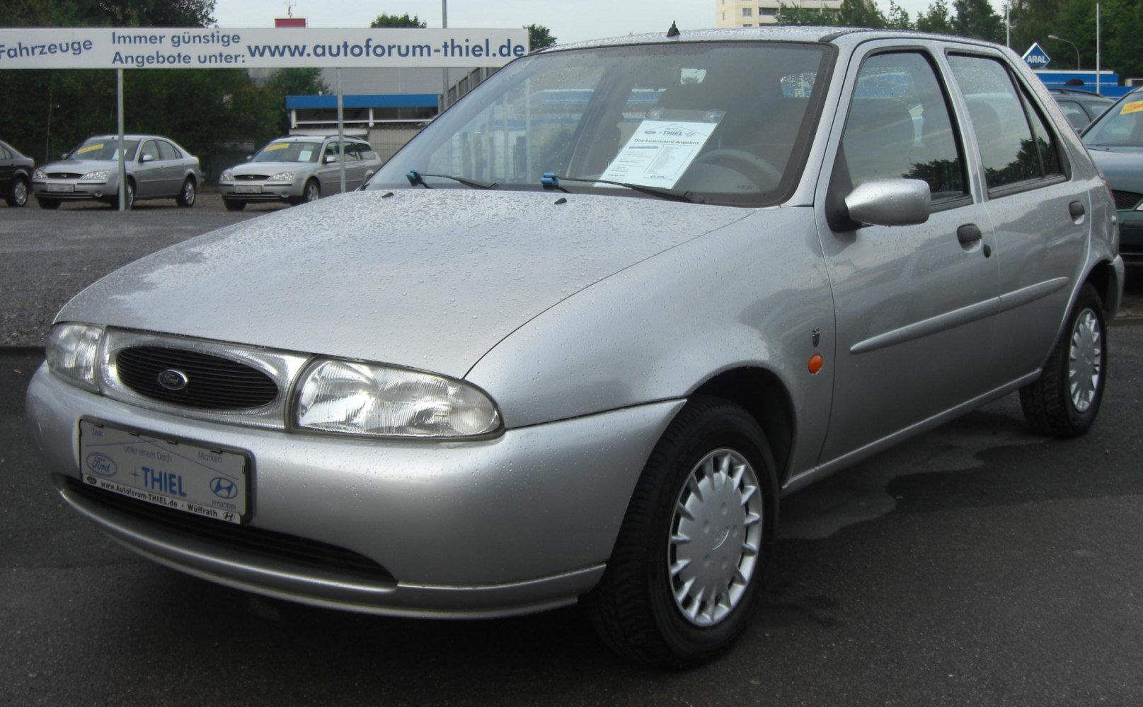 Compact 5-door hatchback with oval headlights and aerodynamic front design