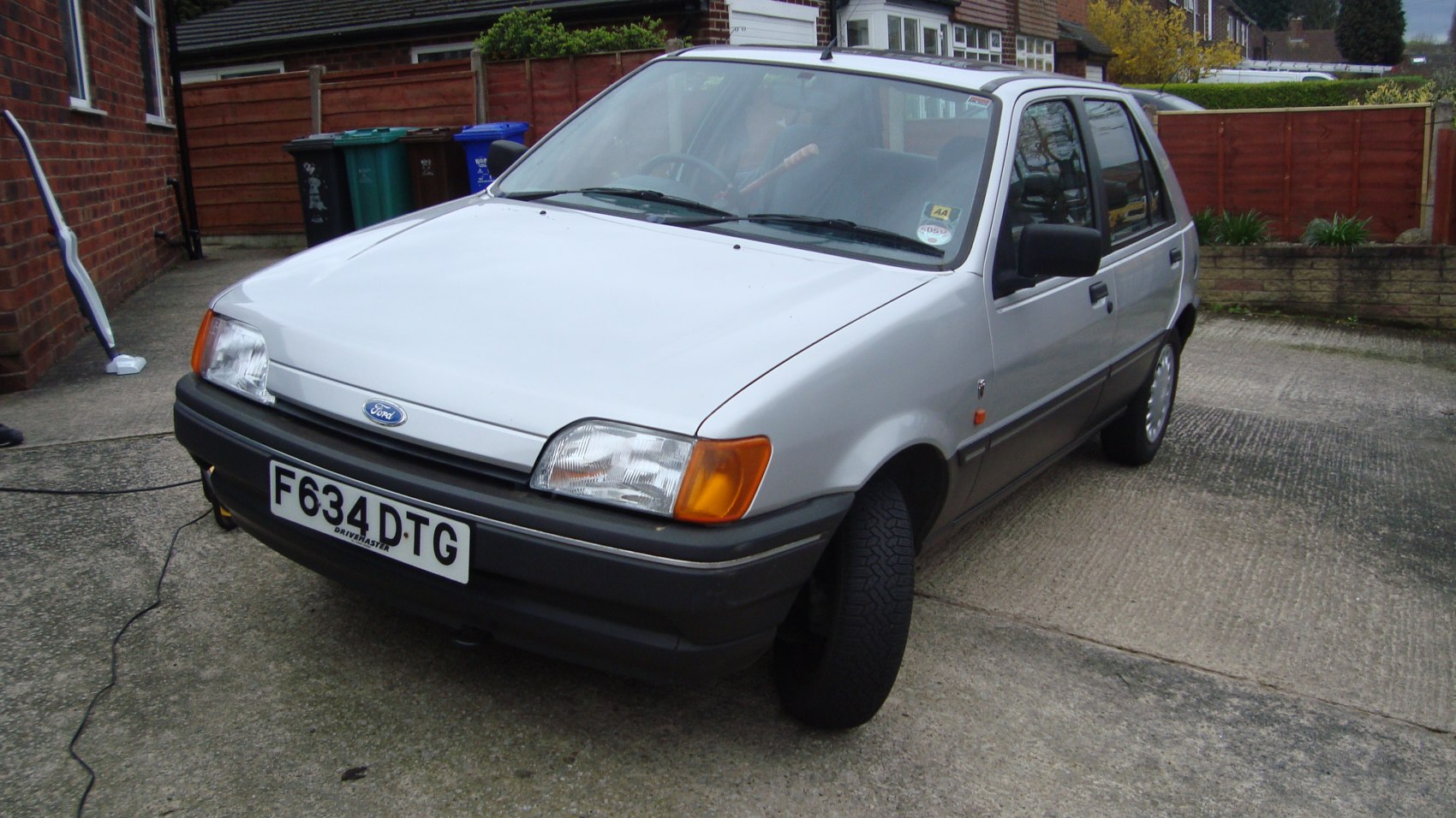 Front and side view of a classic 1989-1995 hatchback with distinctive rectangular headlights
