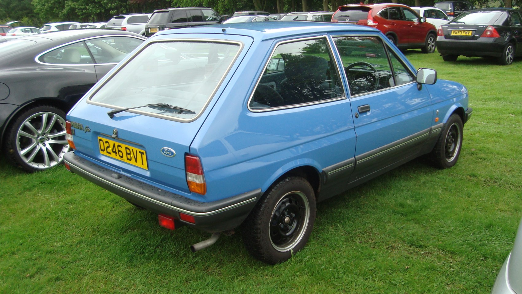 Compact hatchback with rear windshield wiper and black steel wheels with chrome trim