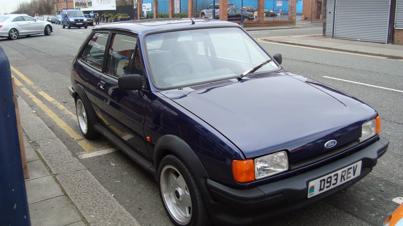 Front and side profile of classic compact hatchback with rectangular headlights