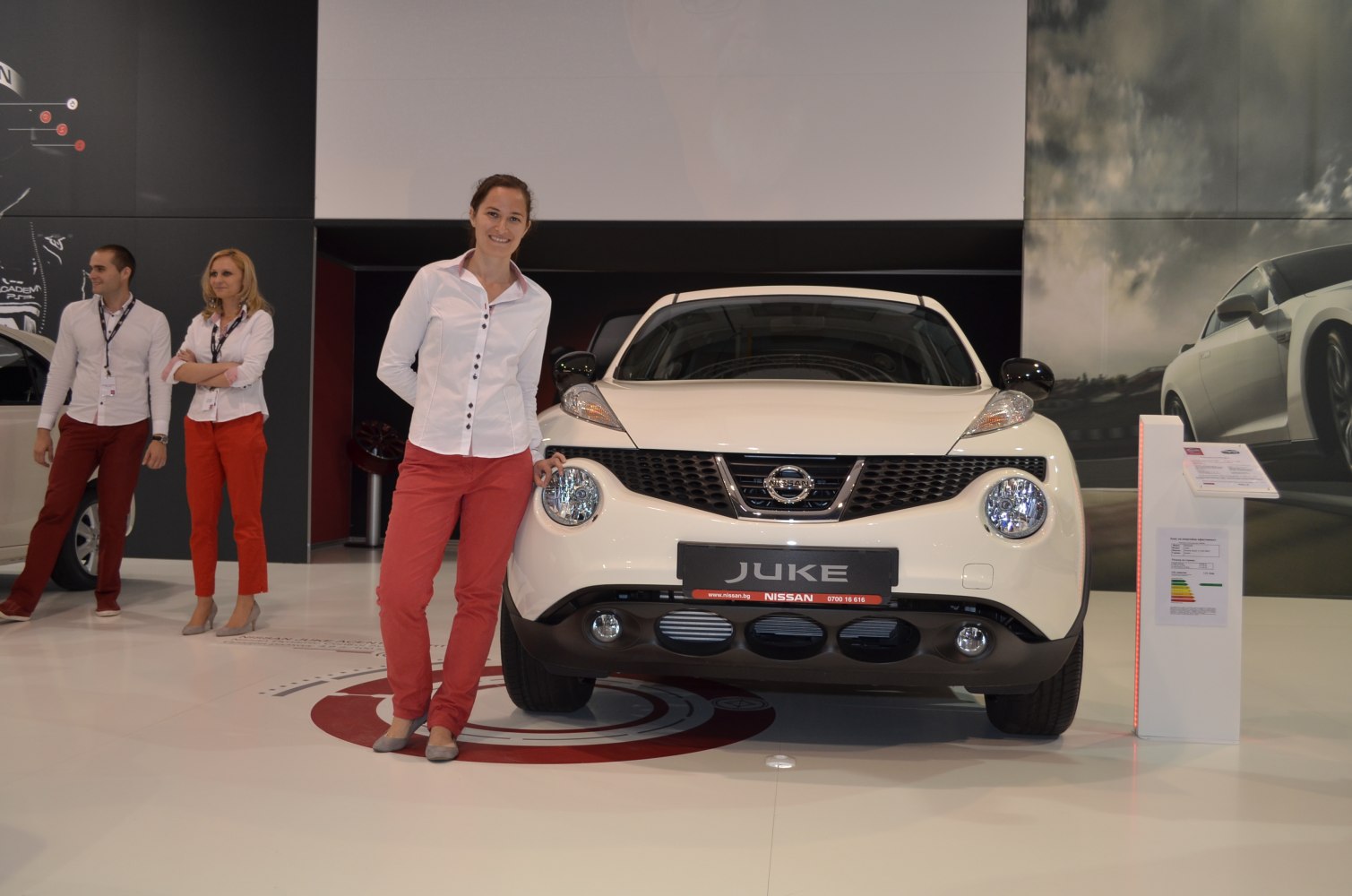 Distinctive round headlights and front grille of a white compact SUV.