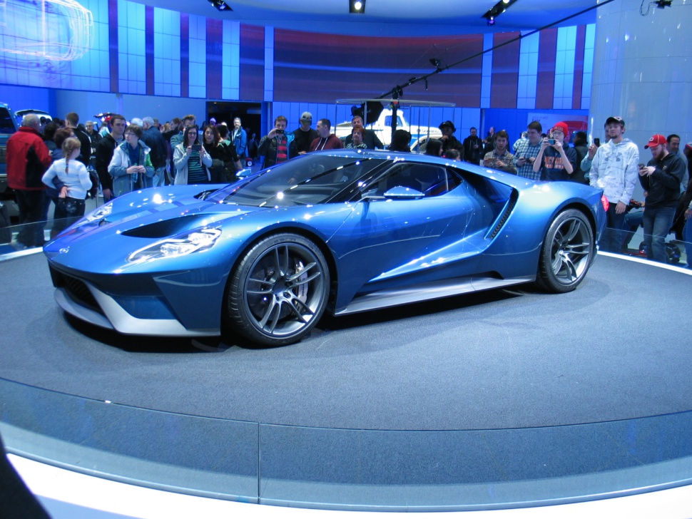 Blue aerodynamic sports coupe with sleek design and performance wheels