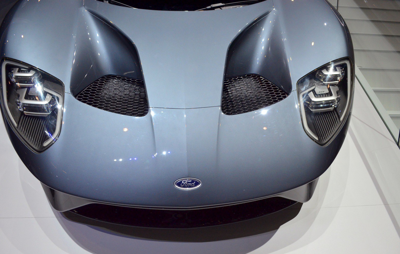 Aerodynamic vents and LED headlights on sleek front hood