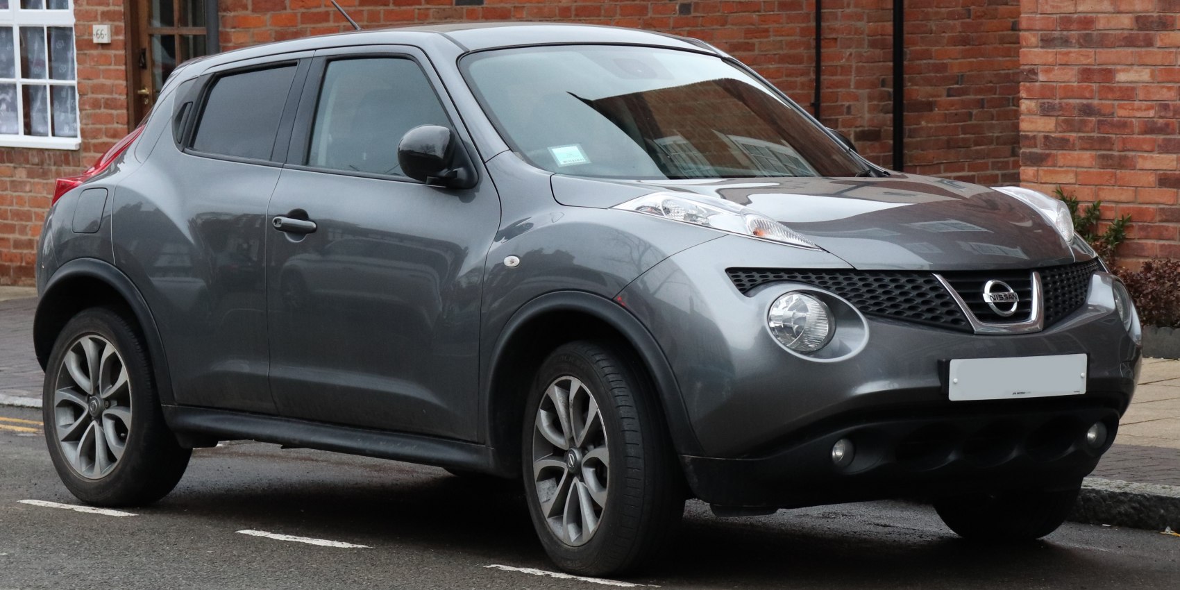Distinctive dual headlights and rounded front end with alloy wheels.