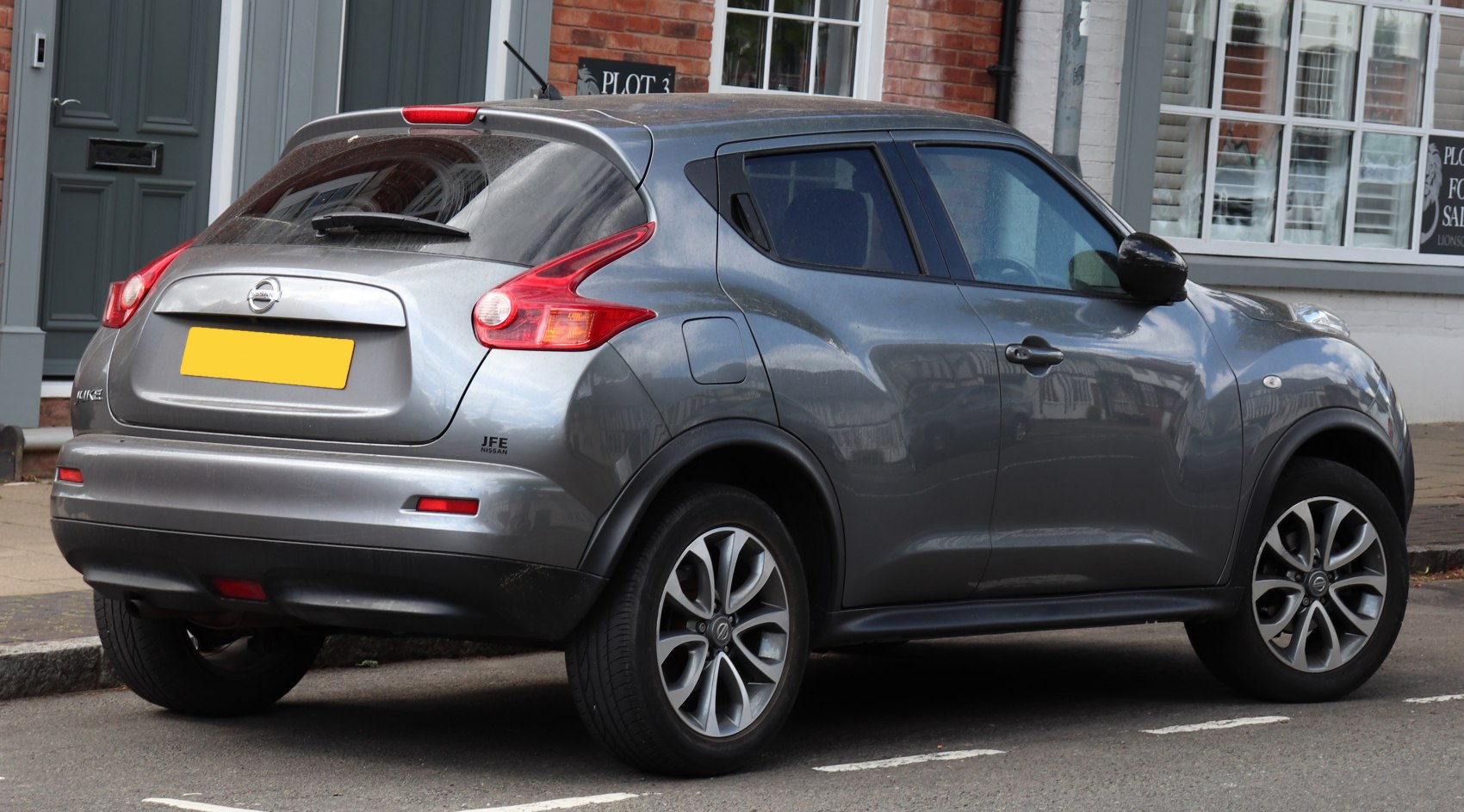 Rear-side view with distinctive taillights and alloy wheels