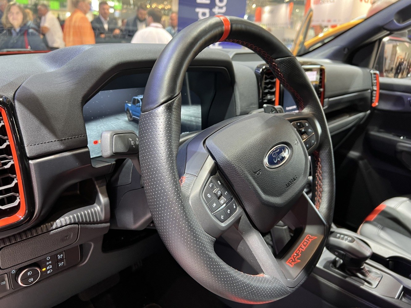 Steering wheel, digital dashboard, red accents