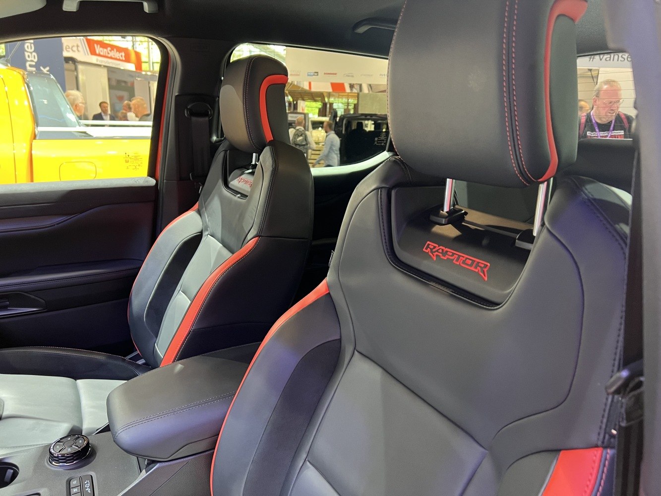 Sporty black and red leather front seats with Raptor branding interior