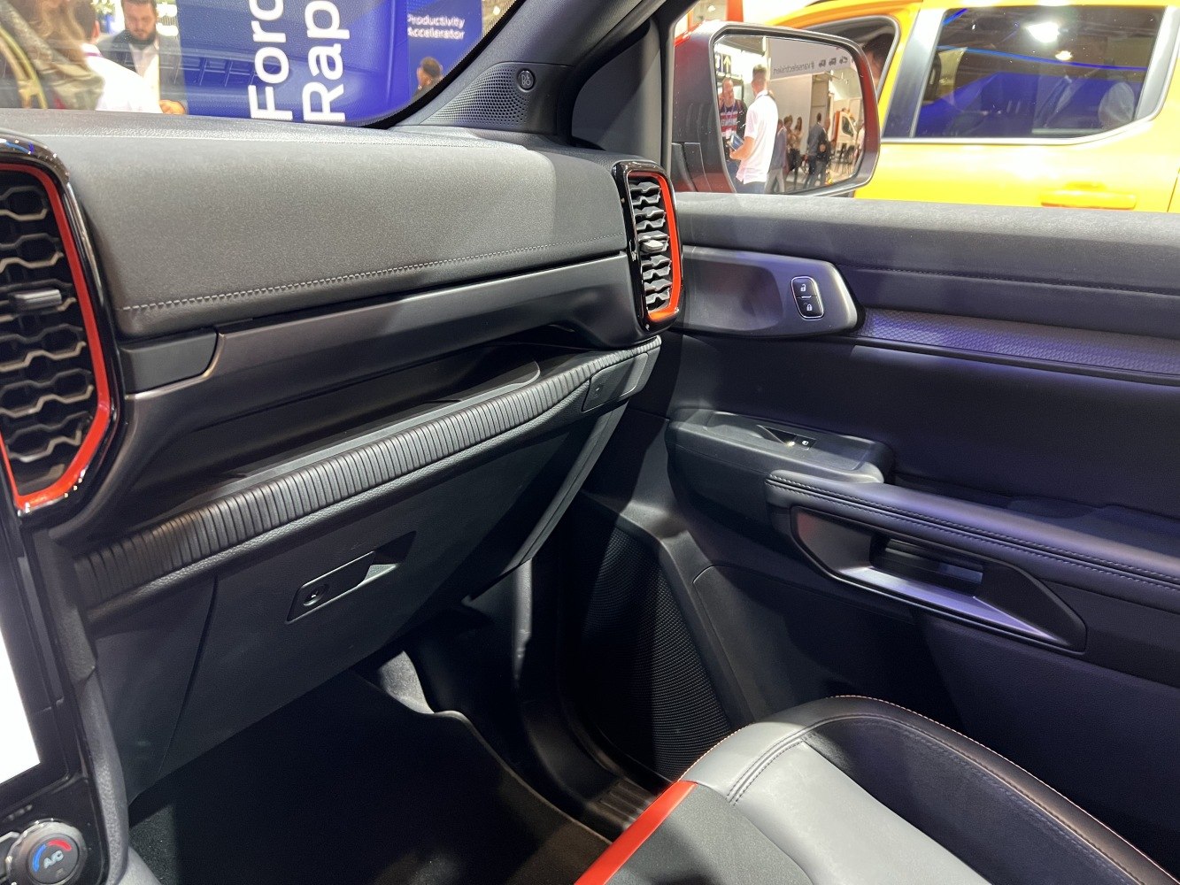 Modern dashboard and door panel with controls and sporty trim