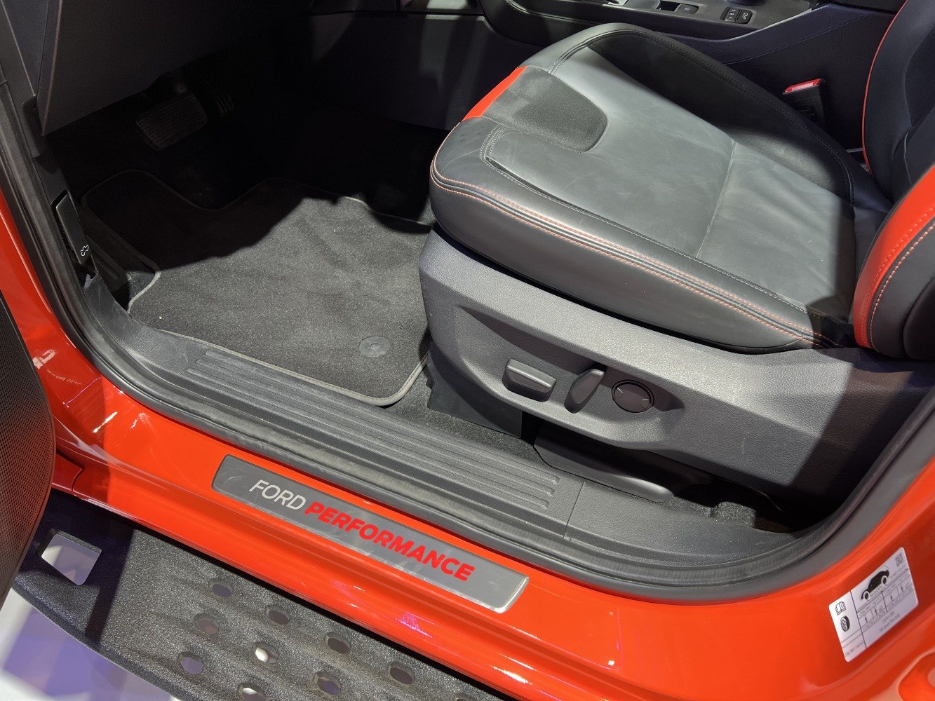 Electric seat controls and Ford Performance door sill in truck interior
