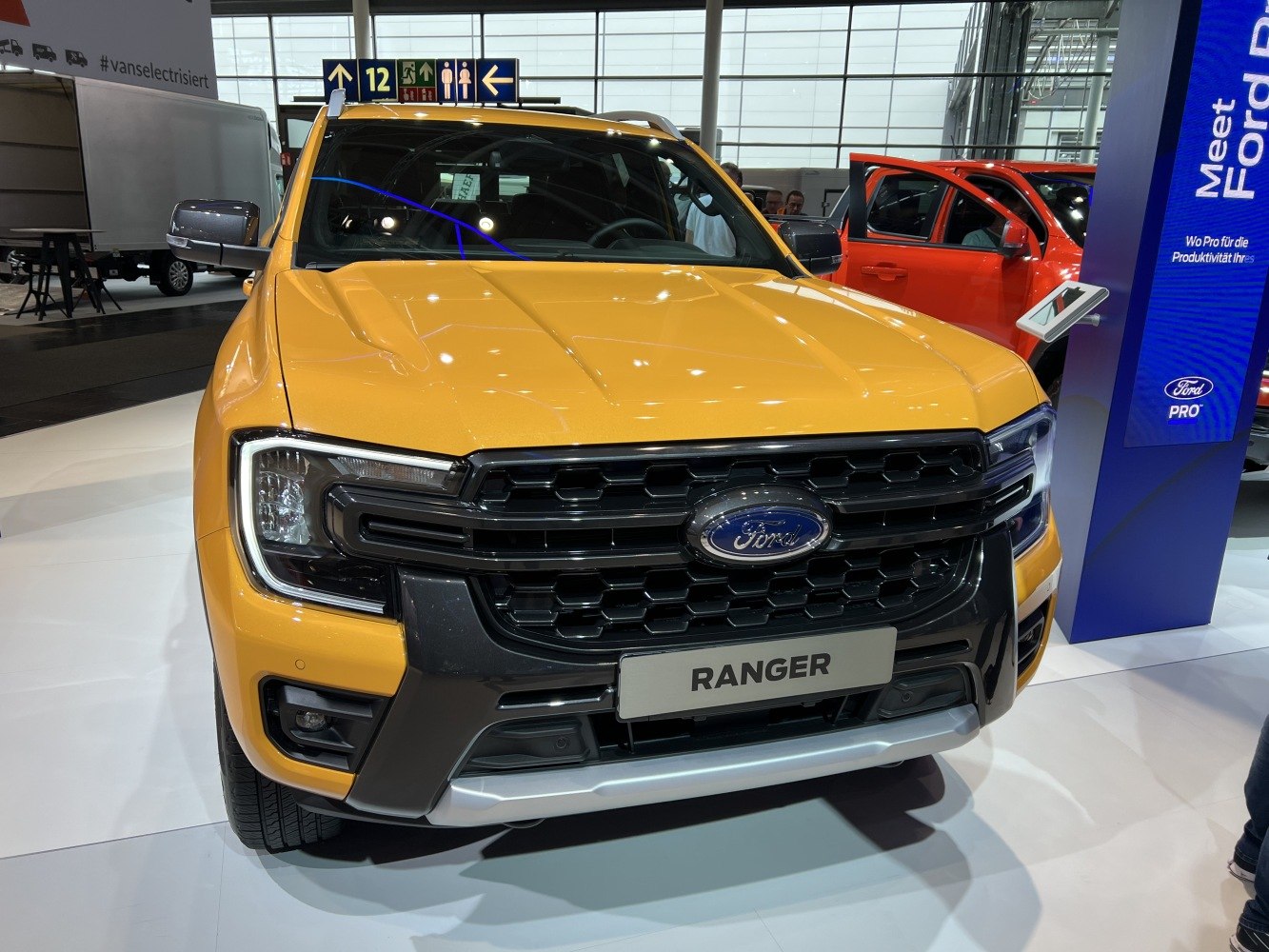 Close-up front view showing hexagonal grille and LED headlights on a pickup truck.