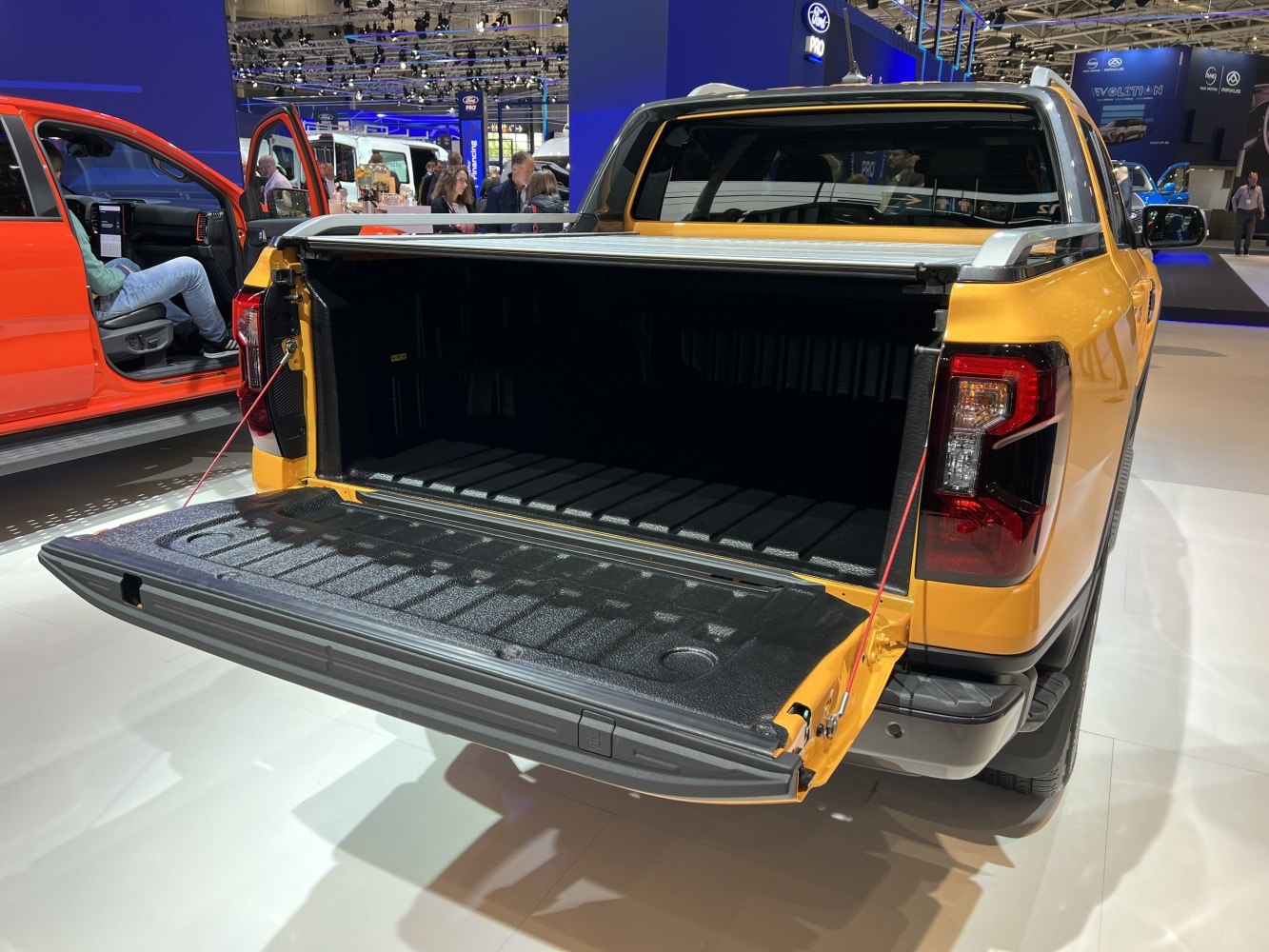 Open tailgate and lined cargo bed of a 2022 pickup truck