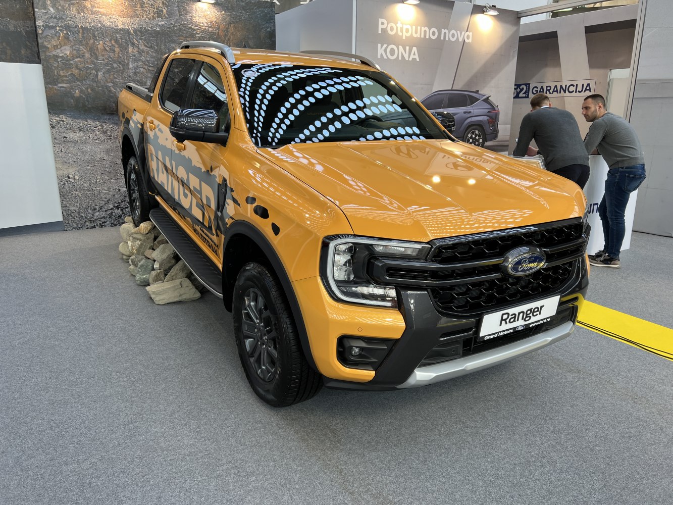 Yellow pickup with bold front grille and rugged design
