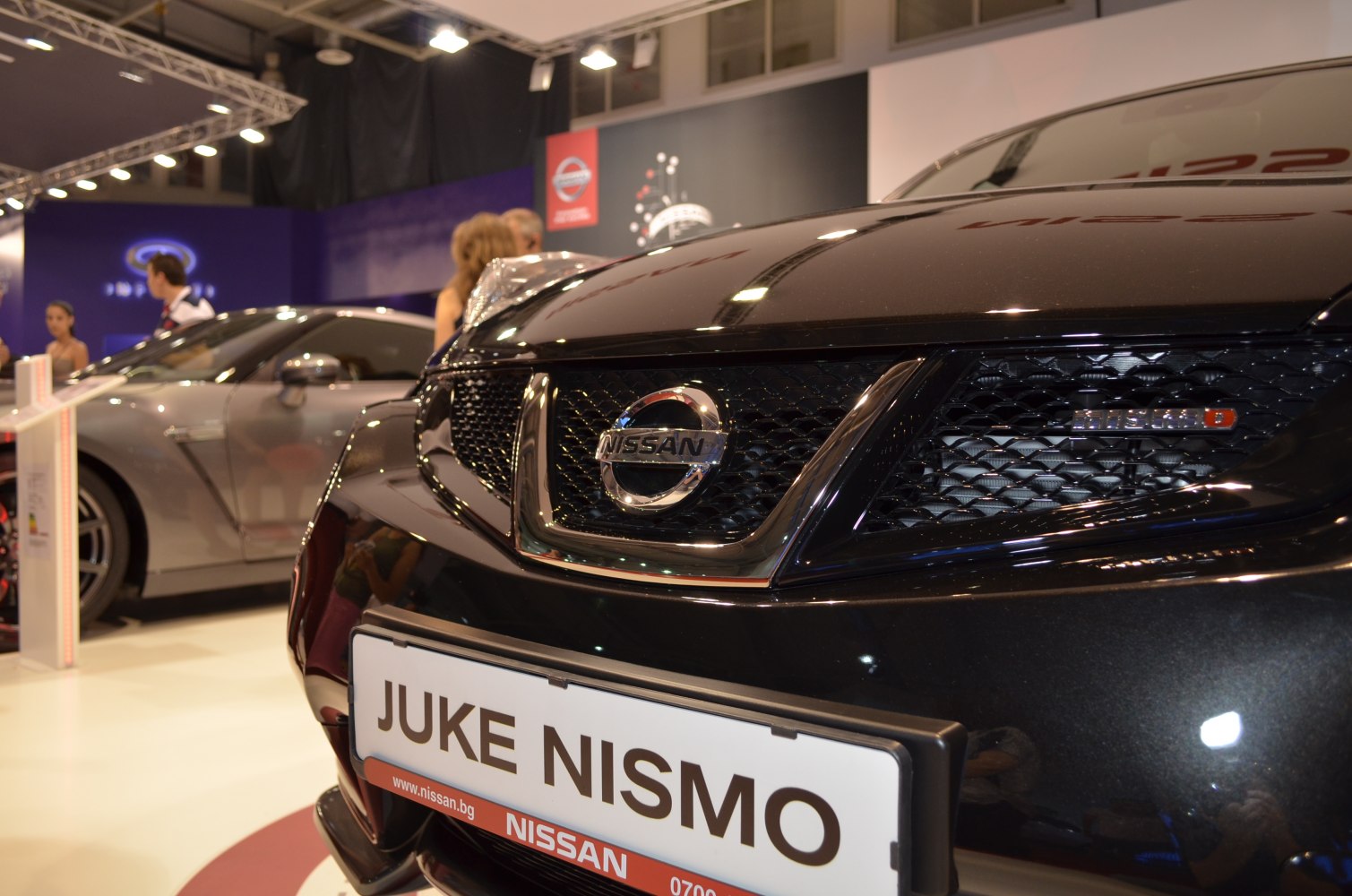 Close-up of front grille with Nissan emblem and Nismo badge