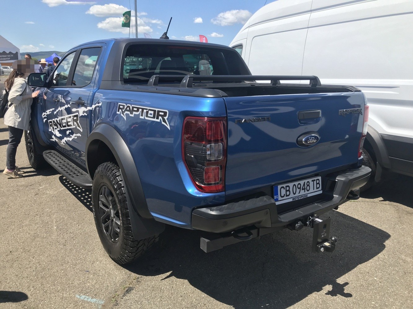Rear and side view of a rugged double cab pickup with cargo bed and off-road features