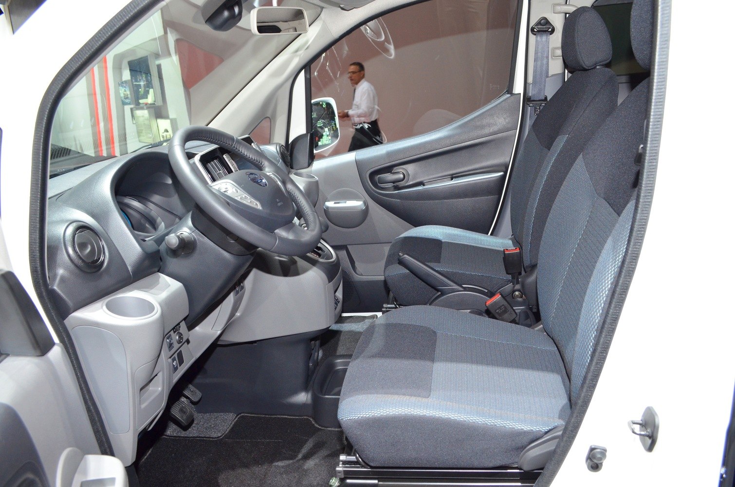 Driver and passenger seats with dashboard and steering wheel