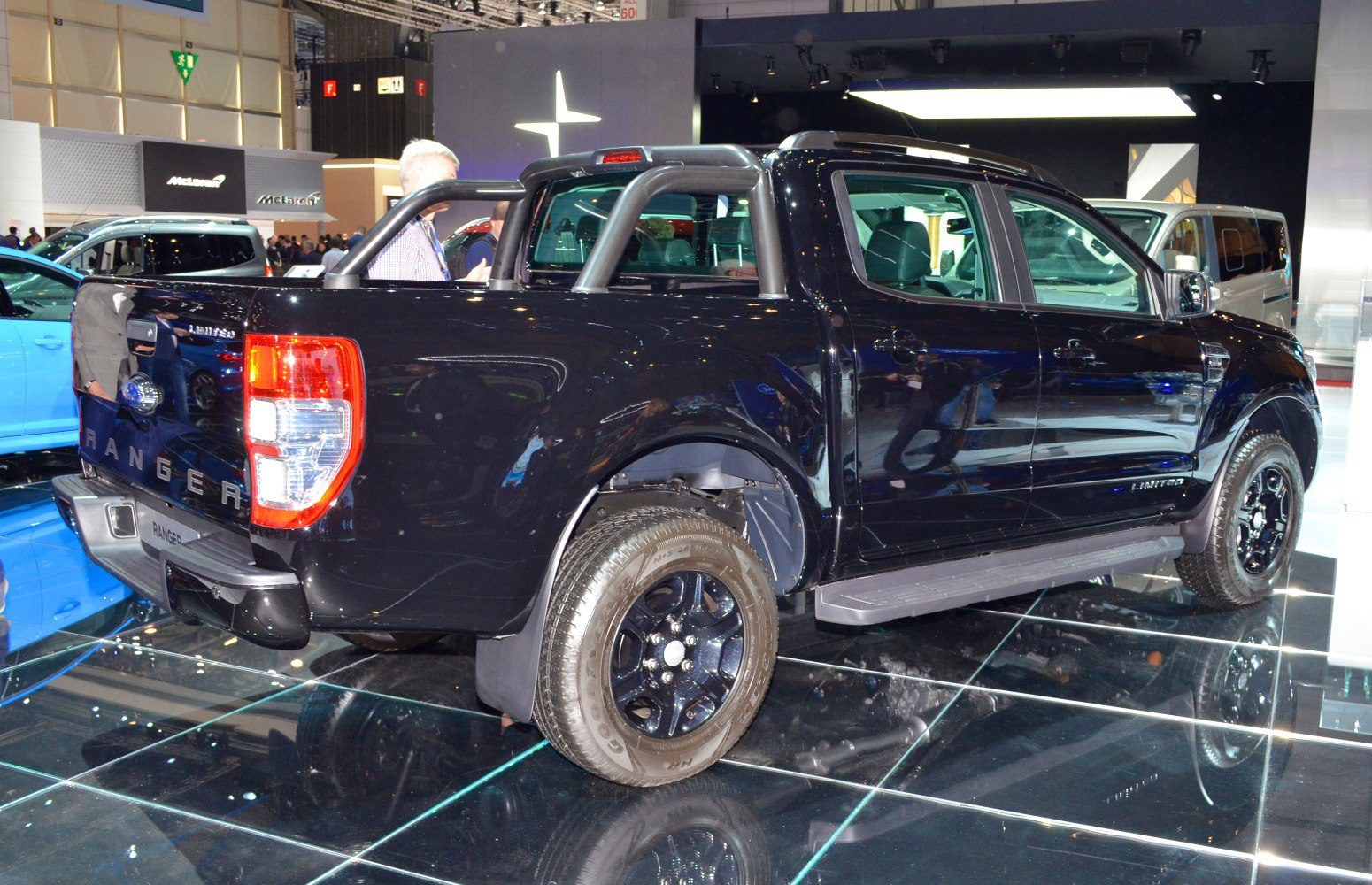 Black pickup truck with double cab and sports roll bar