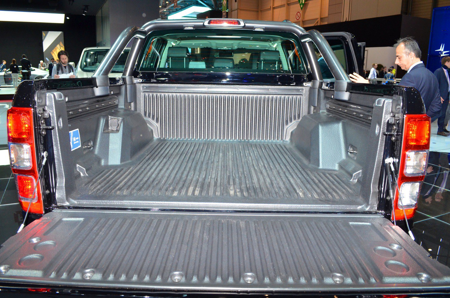 Spacious and durable pickup bed with drop-open tailgate and protective bed liner.