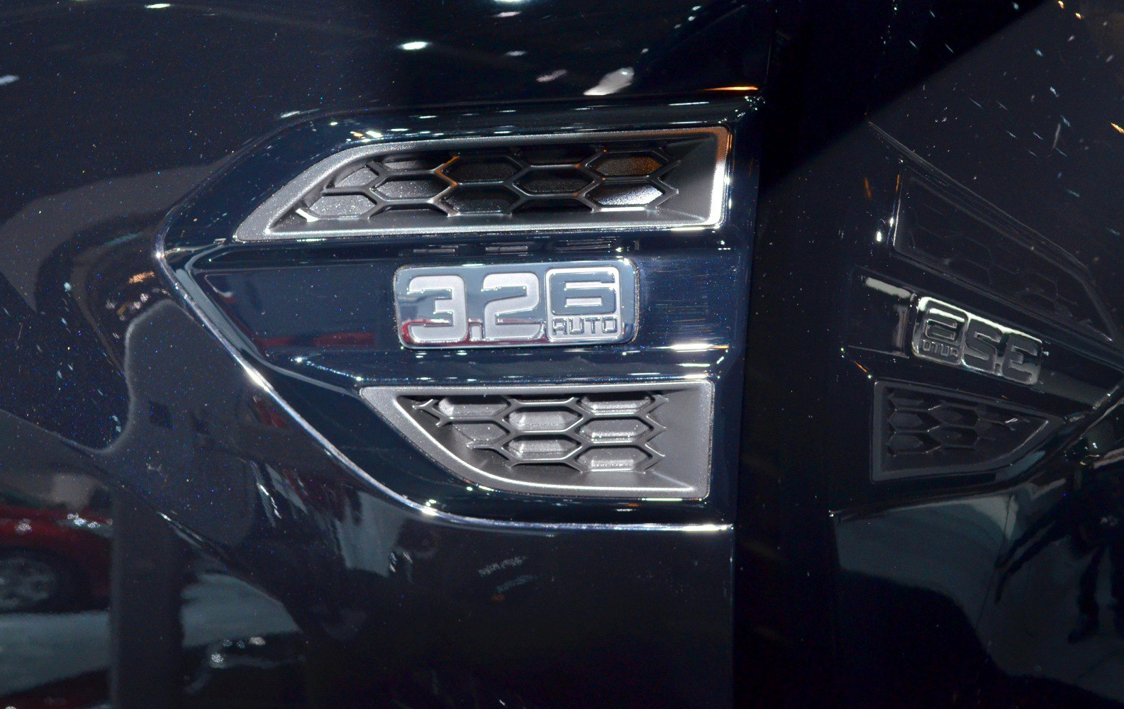 Close-up of 3.2L turbo diesel badge and hexagonal side vents