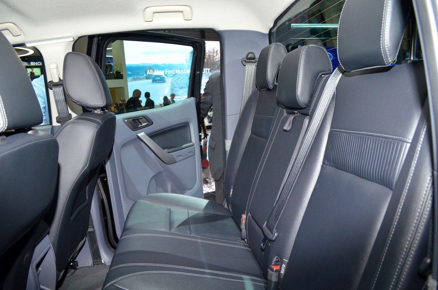 Rear seat interior with black upholstery and headrests