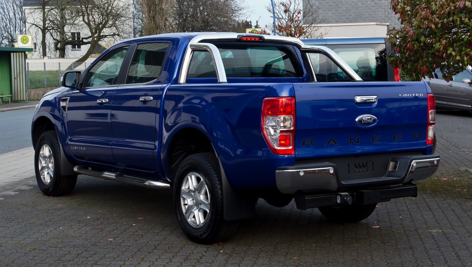 Rear and side view of a double cab pickup with chrome roll bar