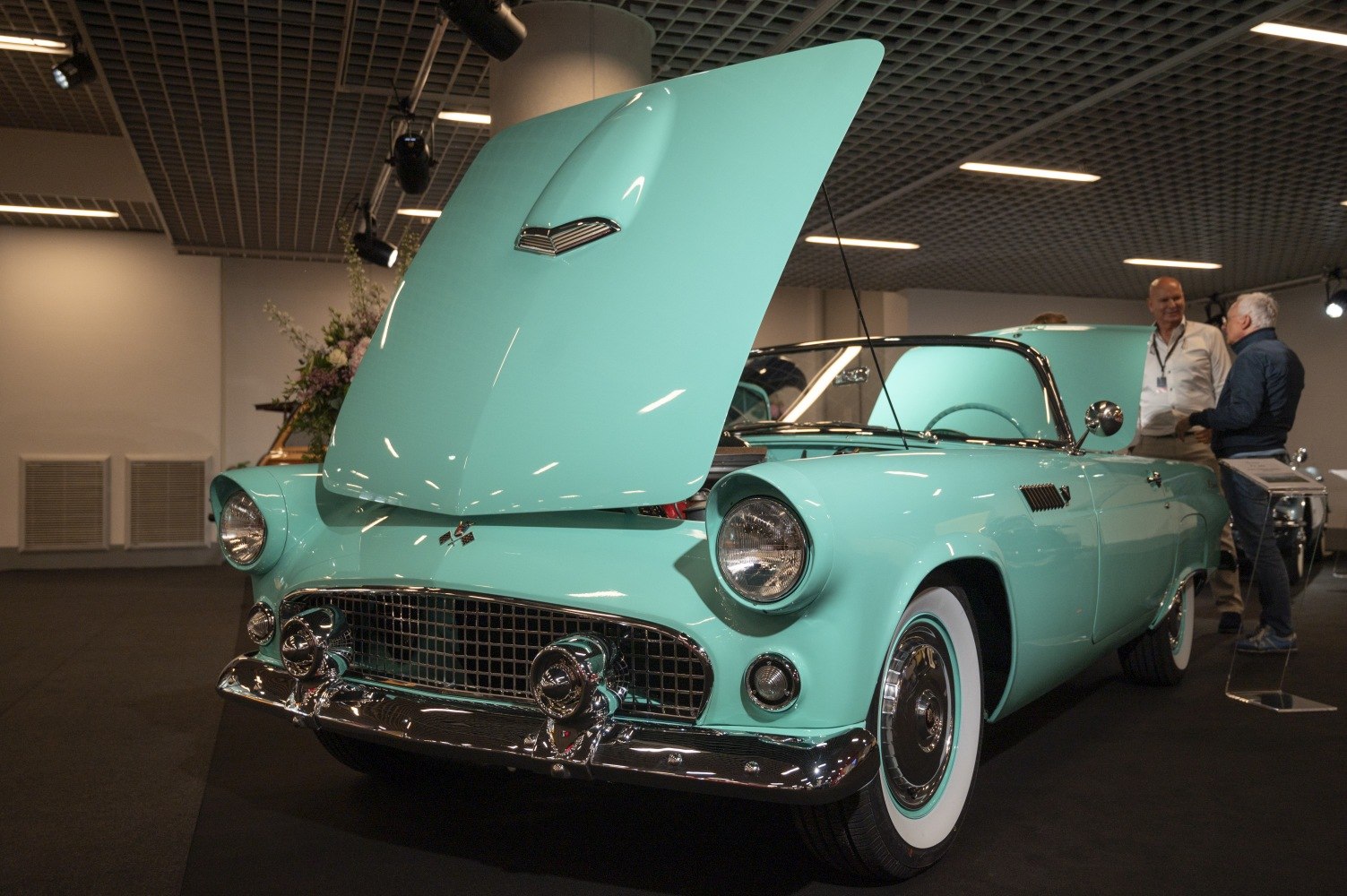 Classic convertible with distinctive open front hood and whitewall tires