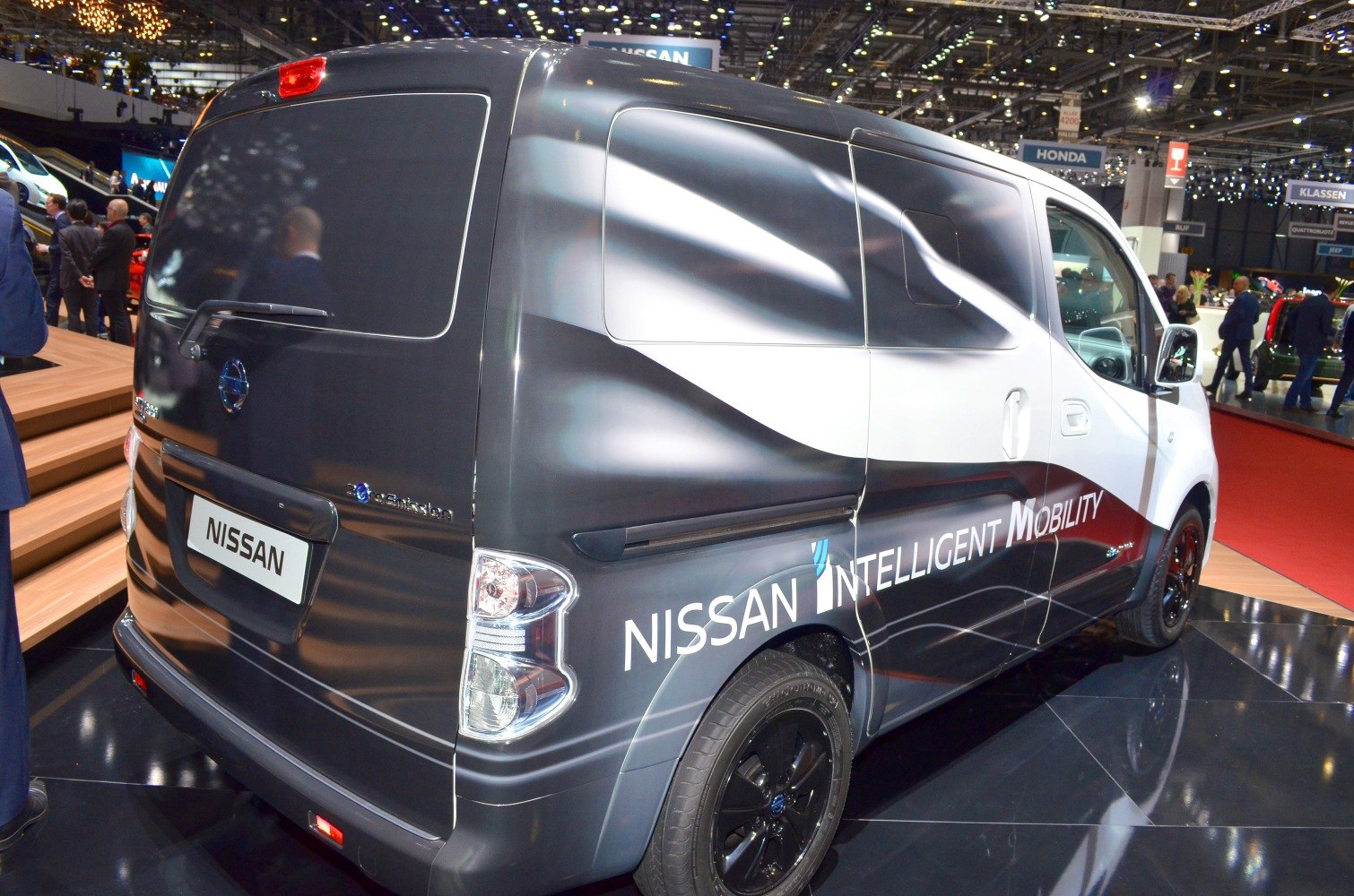 Rear and side view of an electric cargo van with Nissan Intelligent Mobility branding