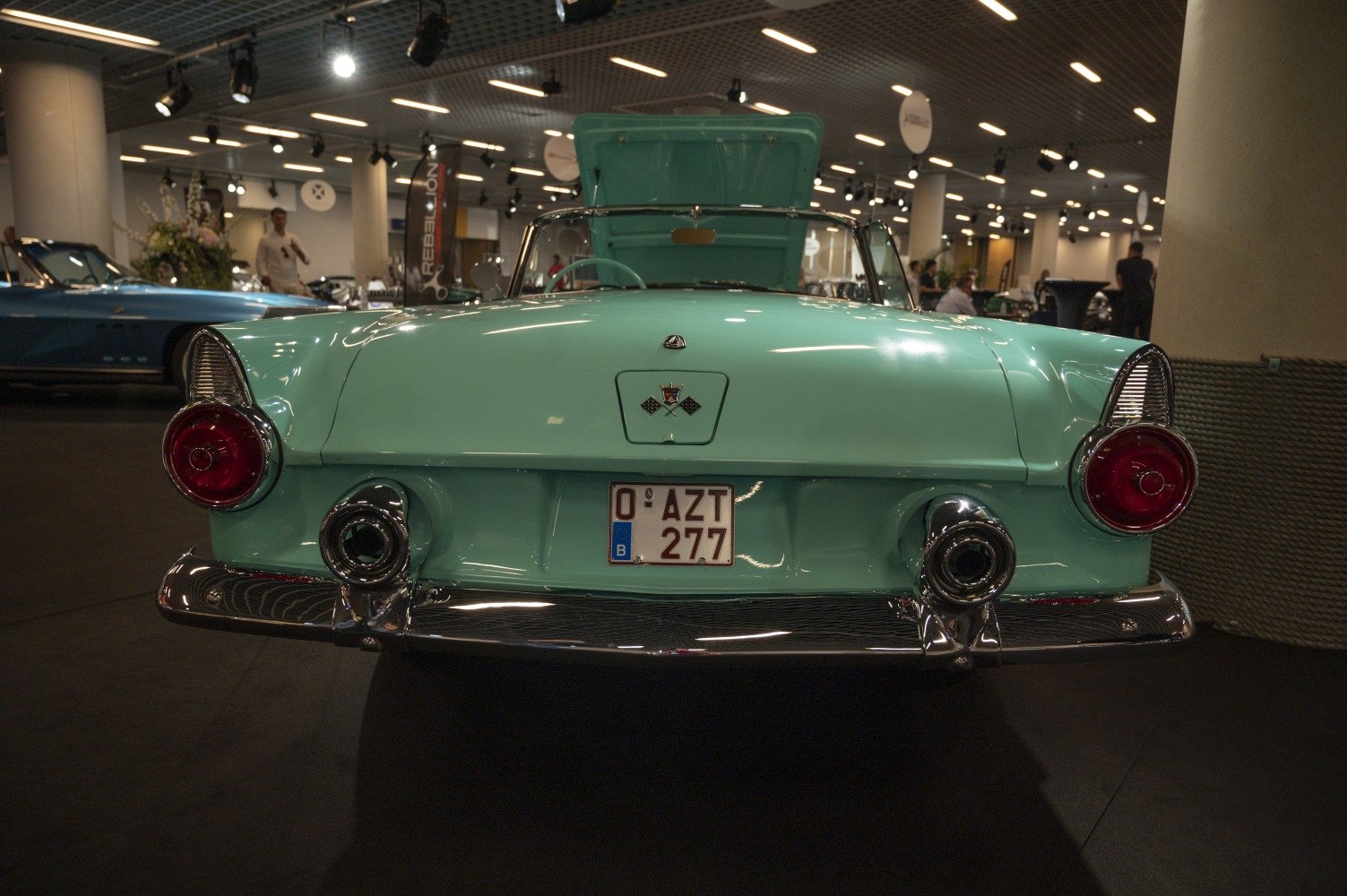 Classic convertible rear with round tail lights and dual chrome exhausts