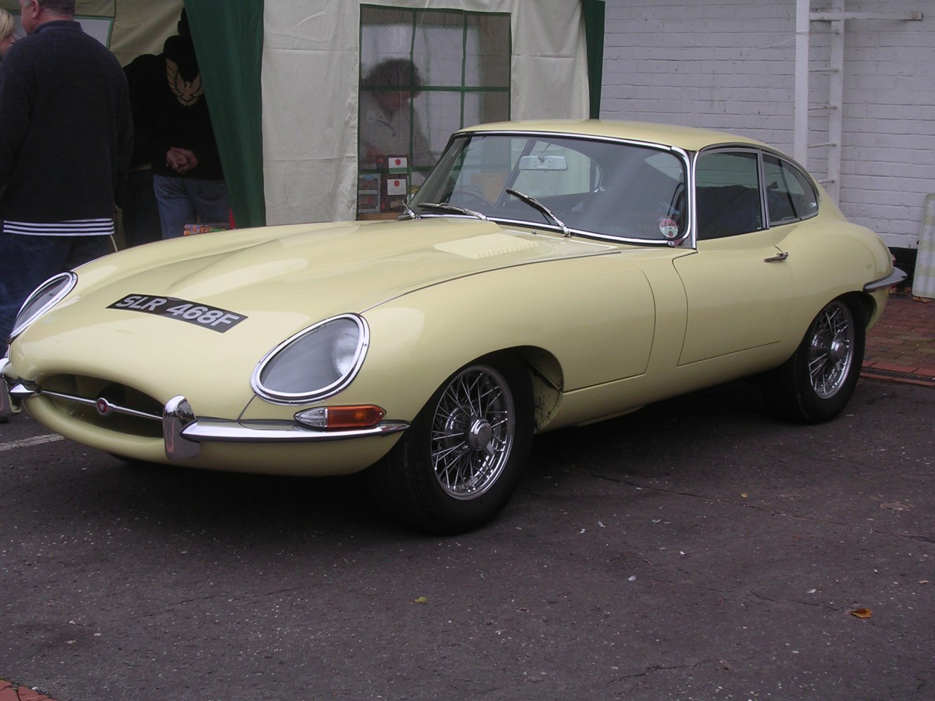 Sleek classic coupe with wire-spoke wheels and iconic 1960s design
