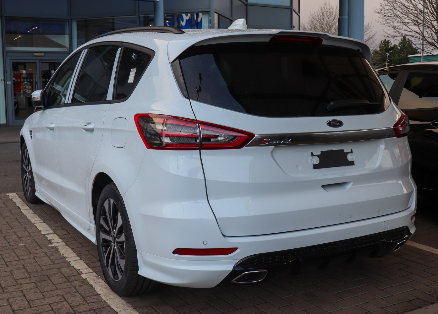 Rear angle view with modern tail lights and rear bumper.