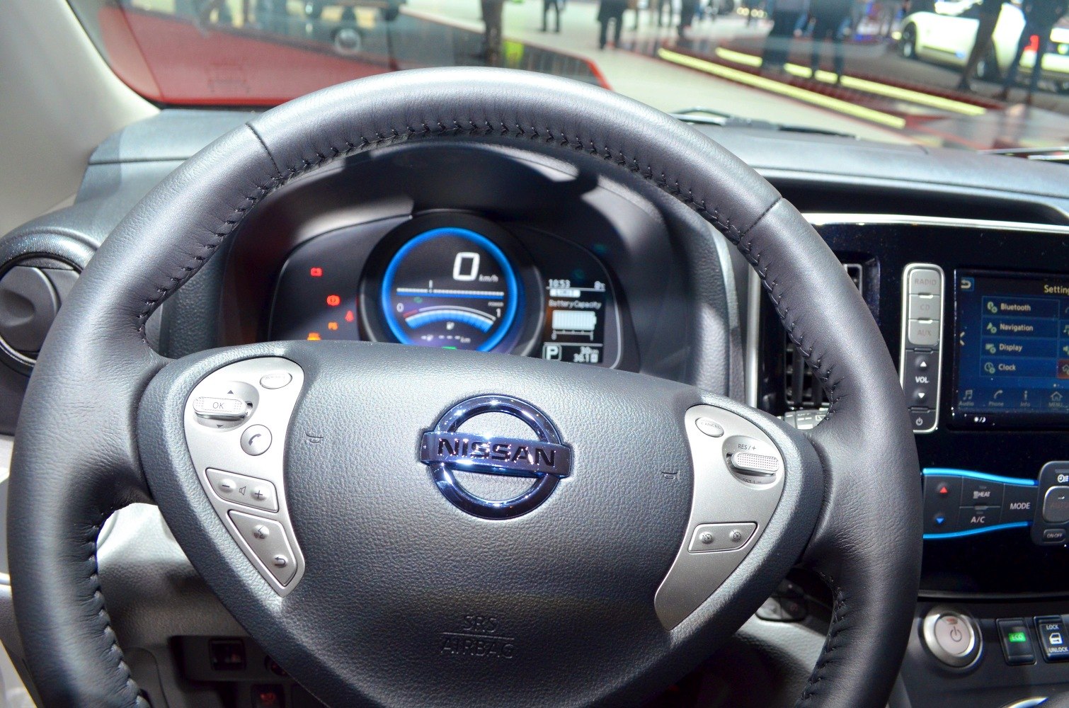 Steering wheel and digital dashboard display with control buttons