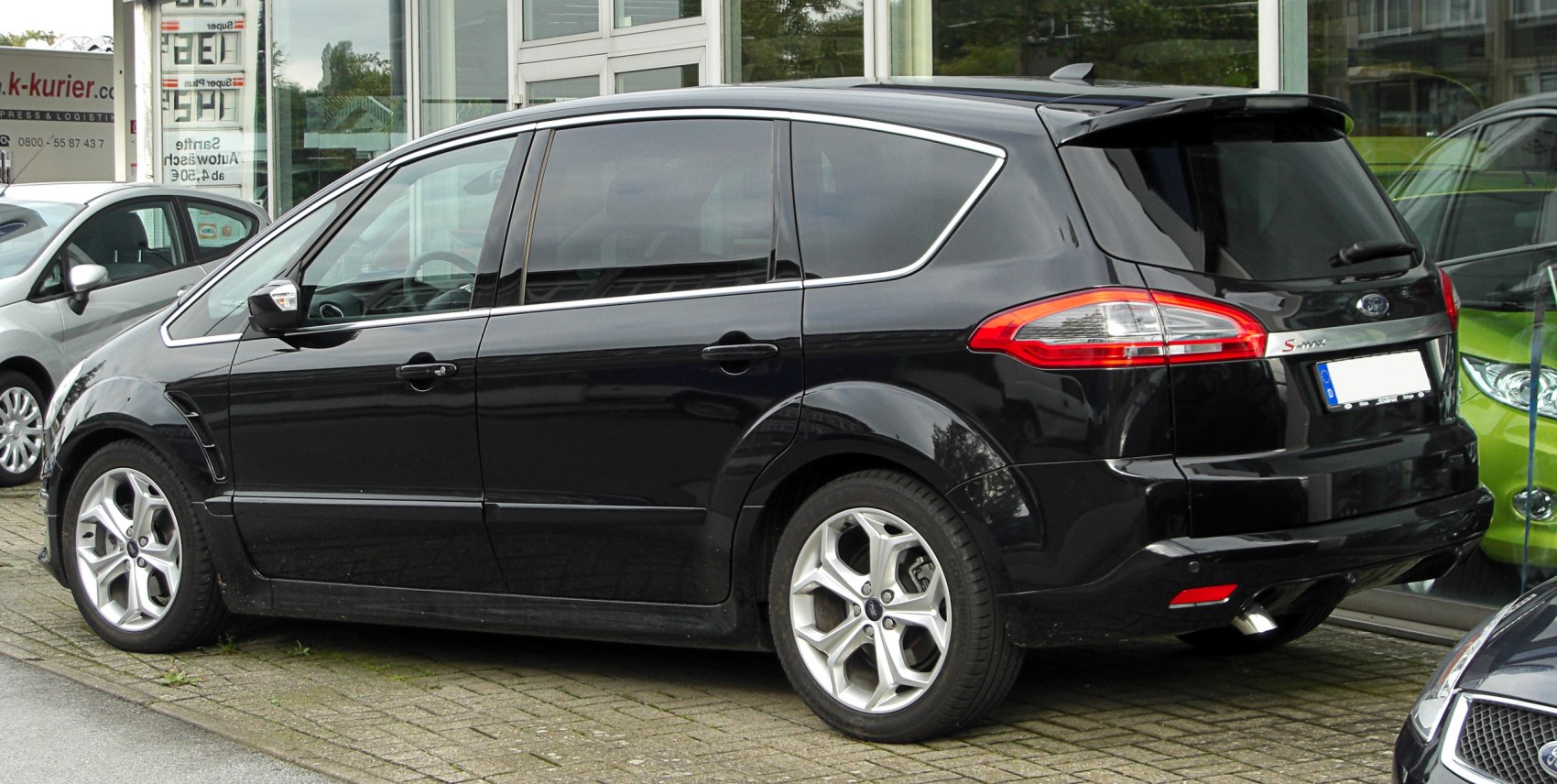 Rear side profile with distinct window and taillights.