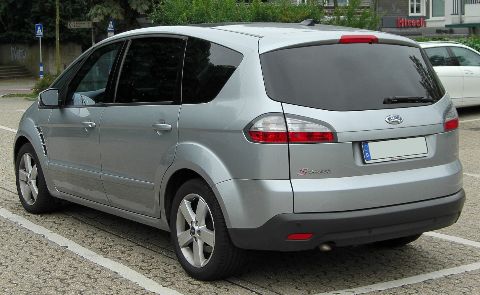 Silver MPV rear side view with tail lights and alloy wheels