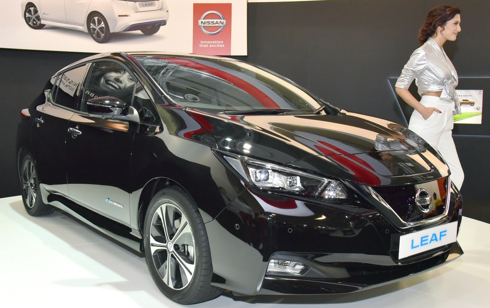 Front side view of electric hatchback with LED headlights and alloy wheels