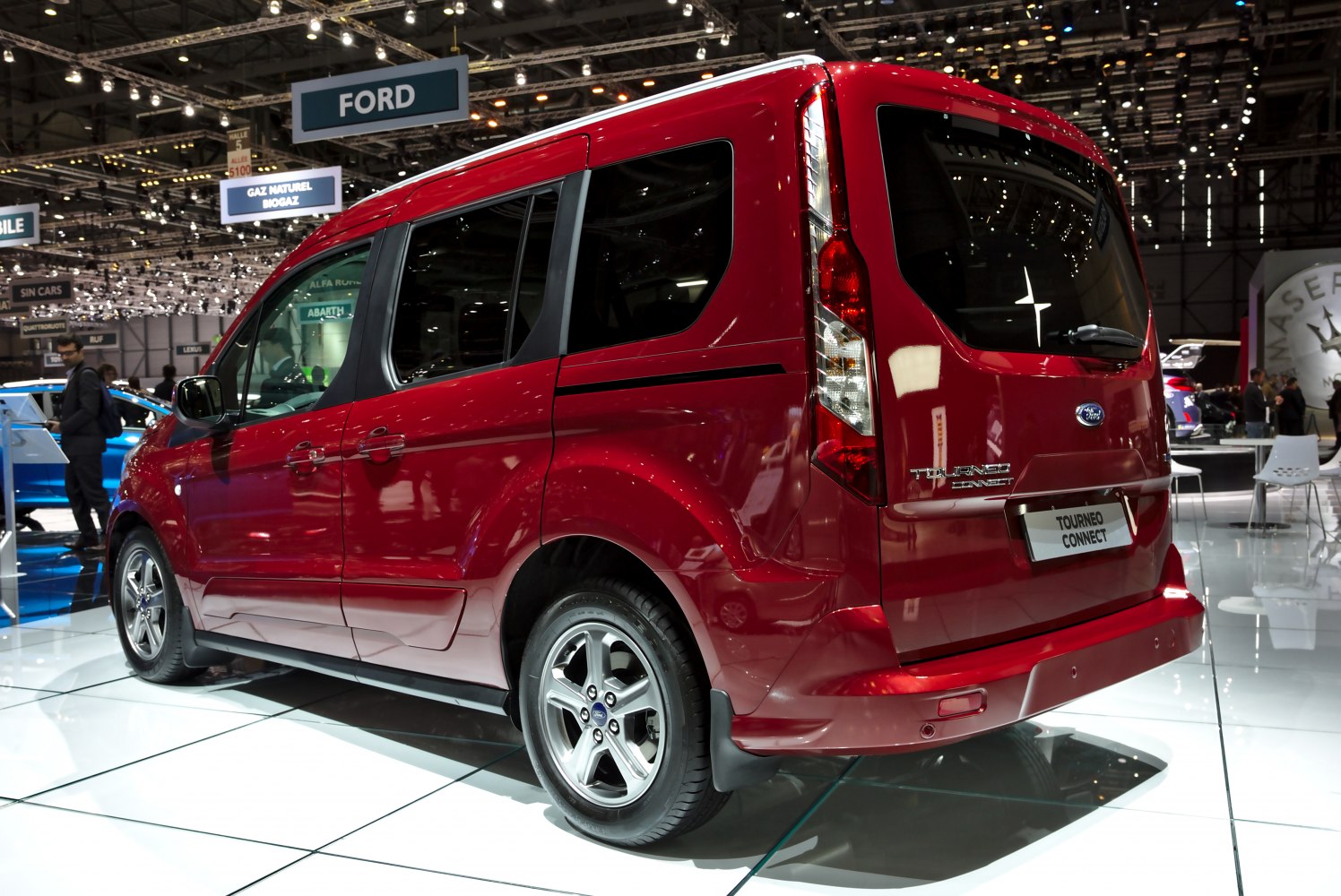 Rear and side profile of red multi-purpose vehicle with alloy wheels