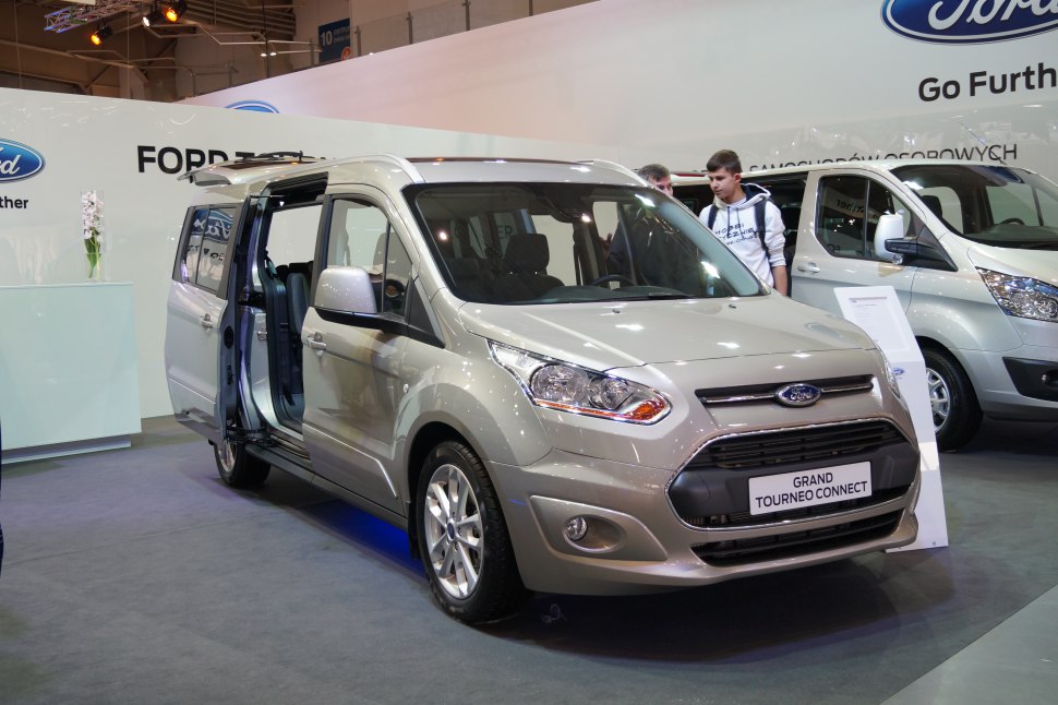 MPV with open sliding side door and front fascia visible