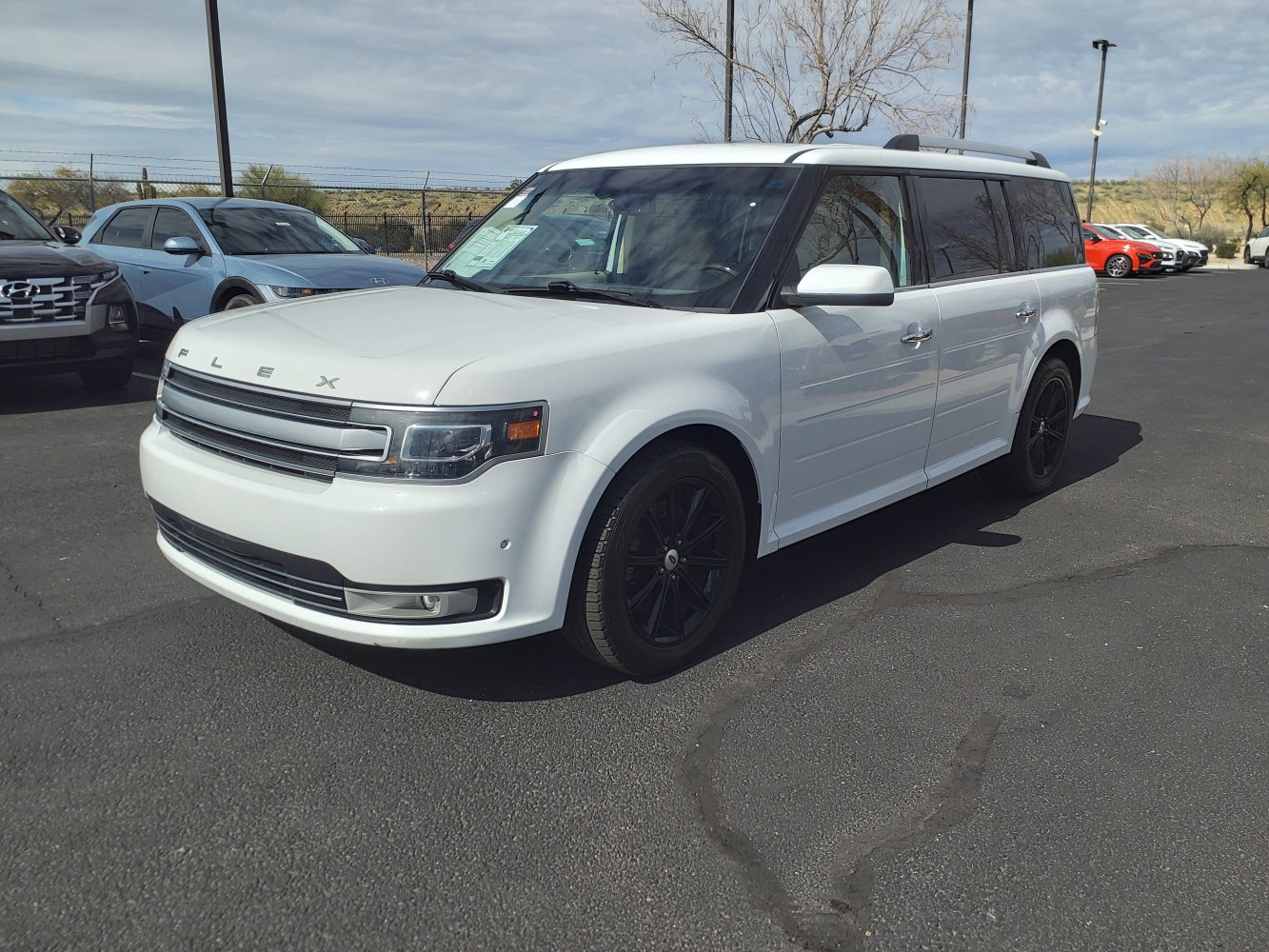 Boxy SUV front and side view with white body and black wheels