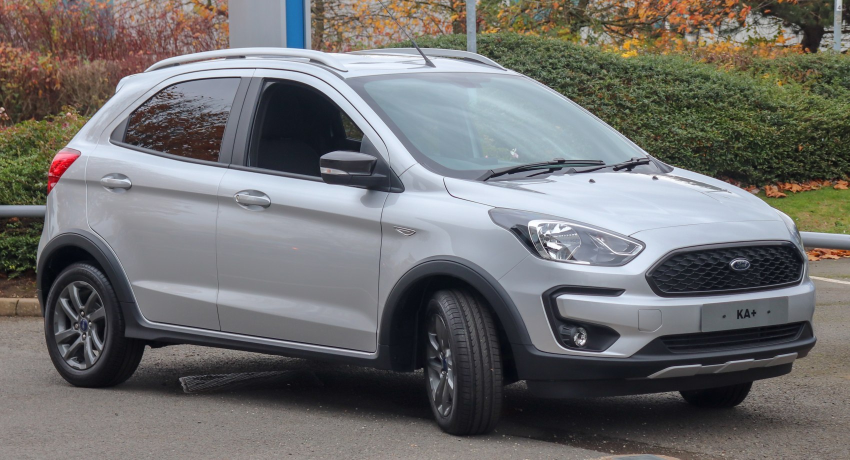 Compact crossover with raised suspension and roof rails