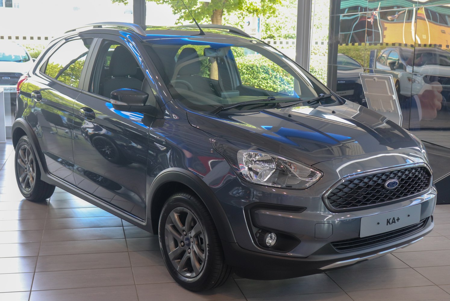 Compact hatchback with roof rails and fog lights