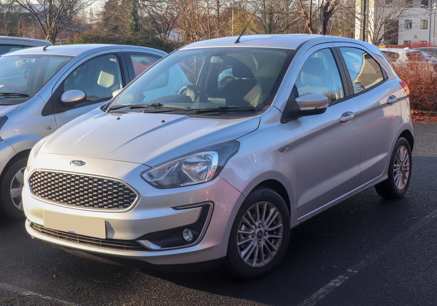 Silver hatchback showing front grille and fog lights