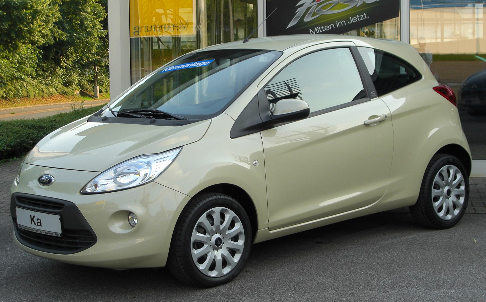 Compact hatchback front side with distinctive headlights and wheels