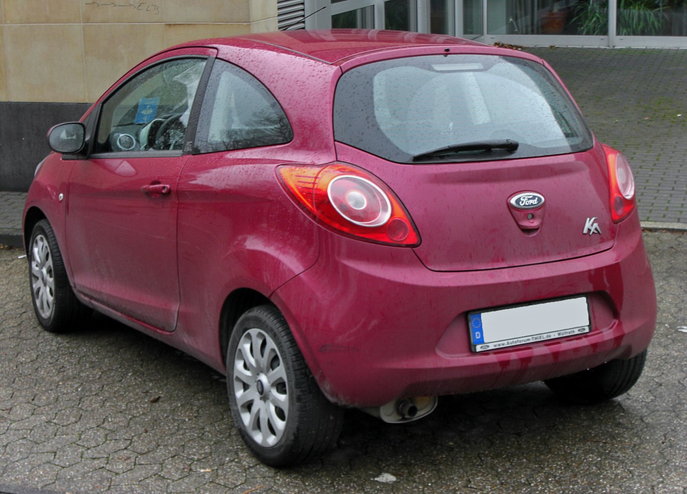 Compact hatchback rear with rounded design and distinctive rear light clusters