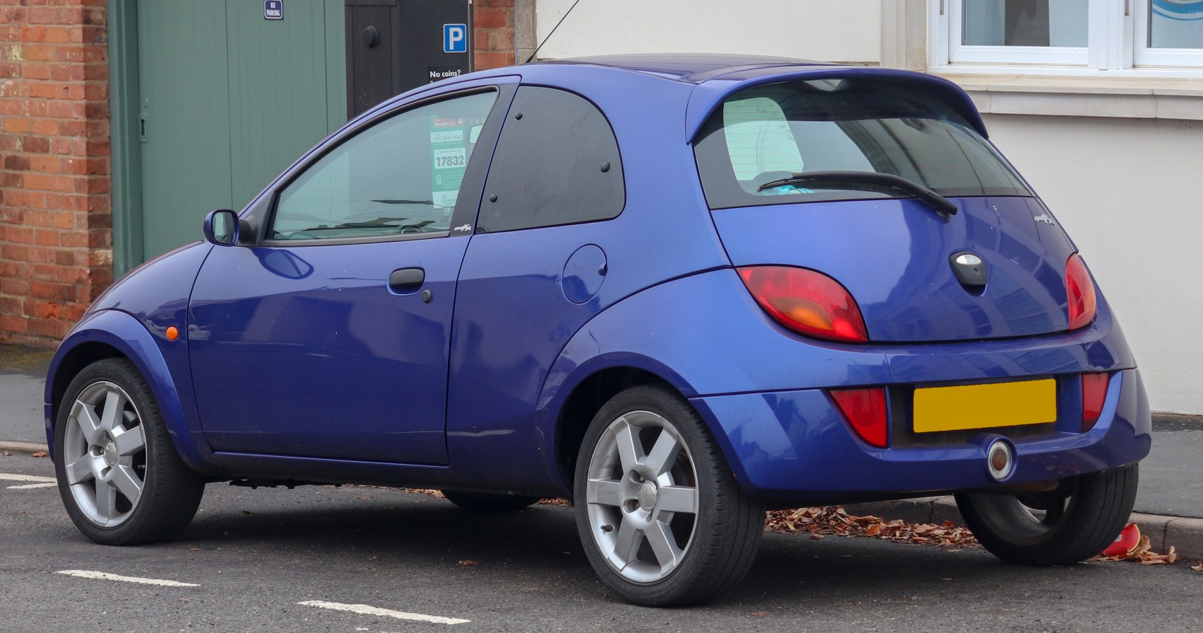 Blue hatchback with alloy wheels and rear roof spoiler